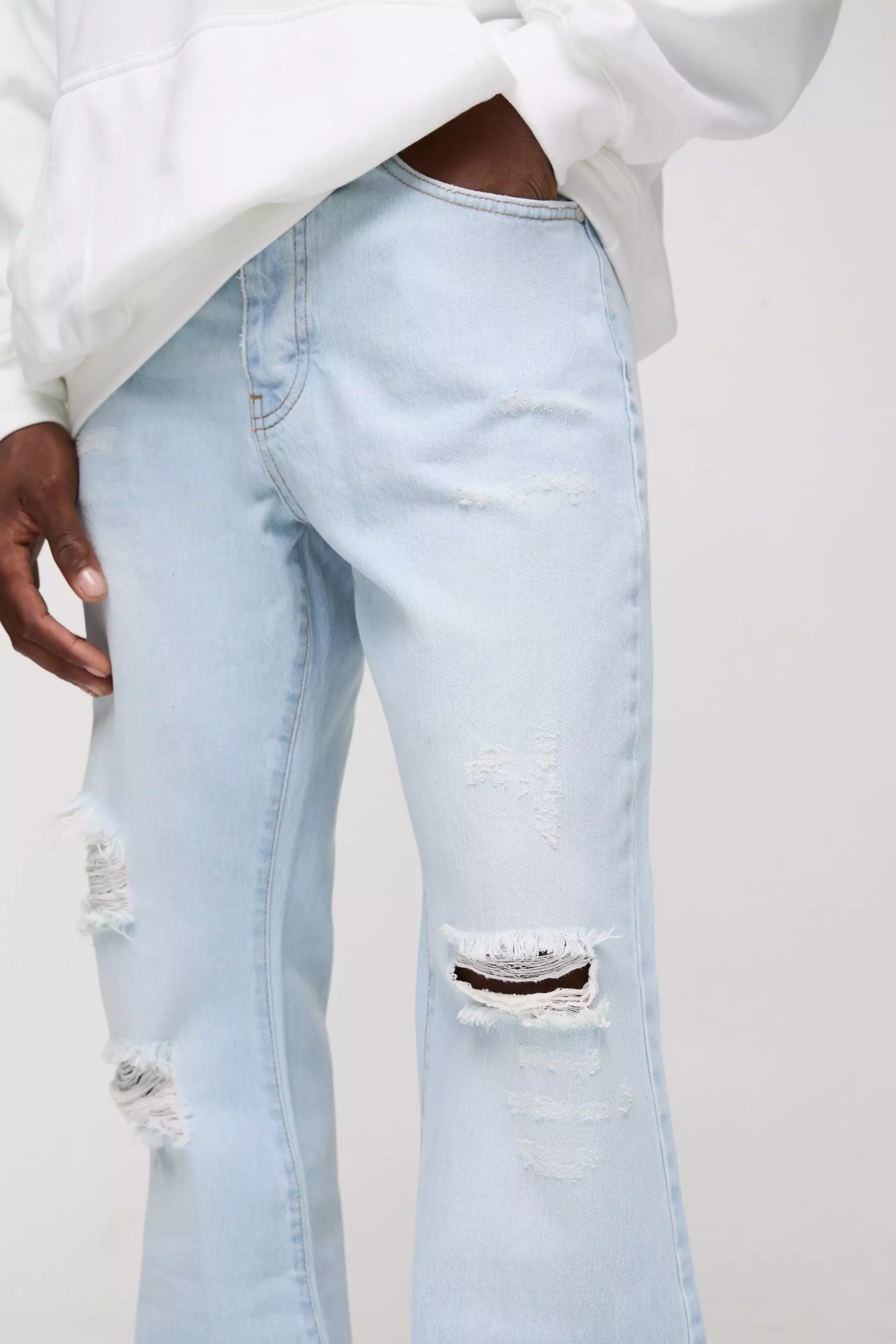 Relaxed Rigid Flare Stacked Knee Rip Denim Jeans | boohooMAN USA